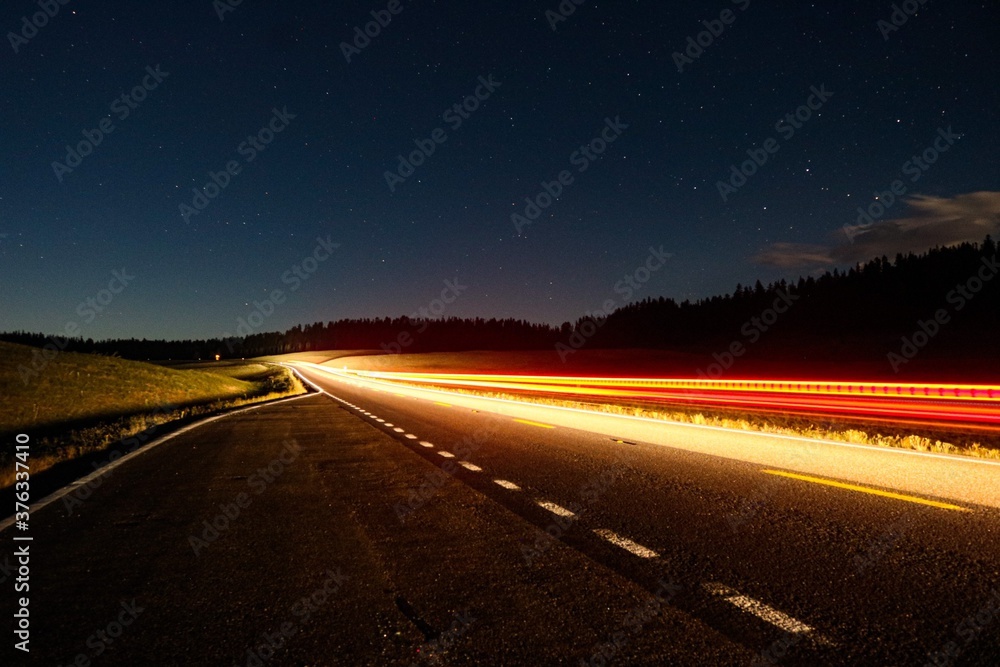 Car driving on the road at night