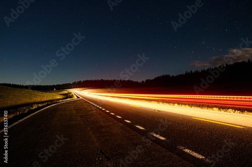 Car driving on the road at night