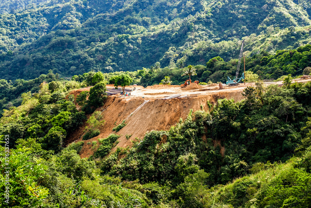 Φωτογραφία Bulldozing mountain soil to flatten for architecture
