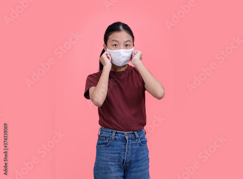Asian teen wearing a medical mask Prevention of covit-19