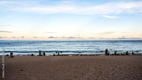 Beach coast line with sea horizon view with people swimming