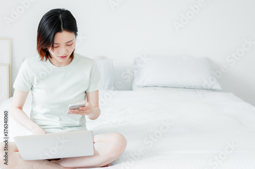 Women use mobile devices at home

