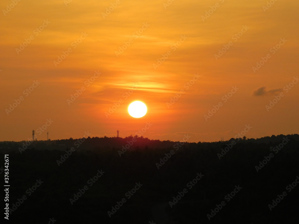 Sunset view of the beautiful orange sun