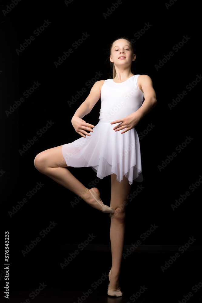Full length portrait of a charming gymnast girl in elegant dress. Full length portrait of a charming gymnast girl in elegant dress.