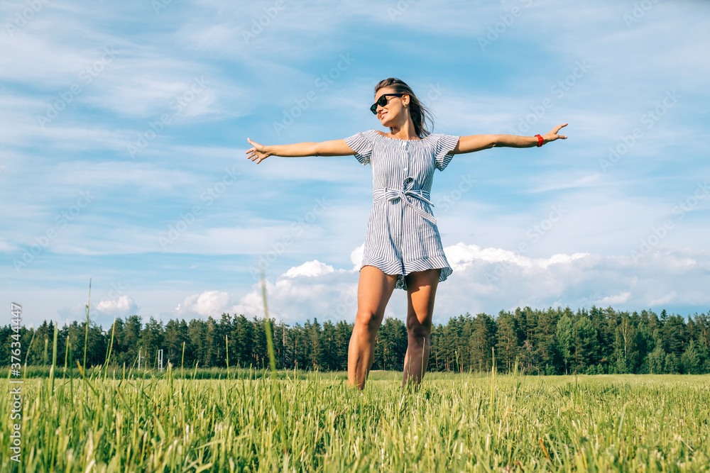Candid girl in the middle of a field in summer Candid girl in the middle of a field in summer