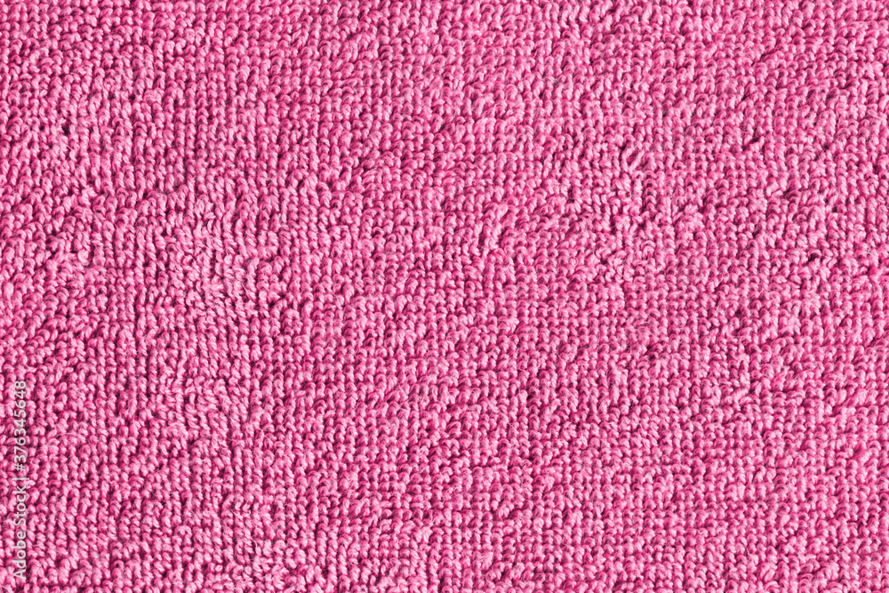 Pink towel texture. Macro fiber pattern. Soft cotton textile material background. Absorbent fluffy cloth. Pink towel texture. Macro fiber pattern. Soft cotton textile material background. Absorbent fluffy cloth.