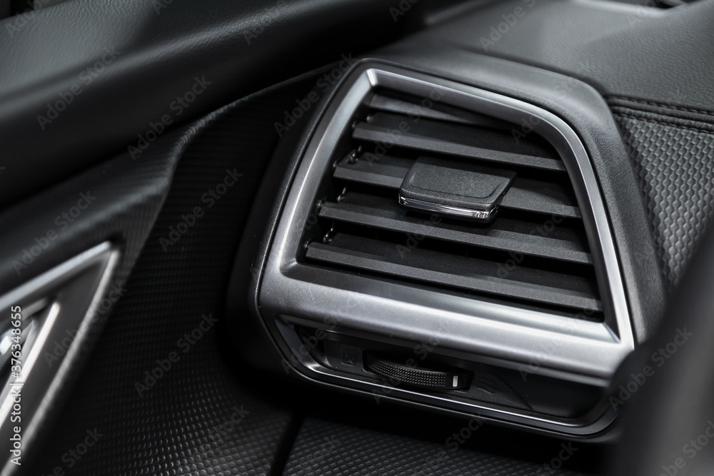 Close up car ventilation system - details and controls of modern car..