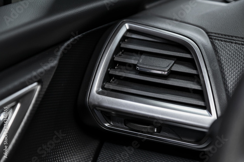 Close up car ventilation system - details and controls of modern car.. photo