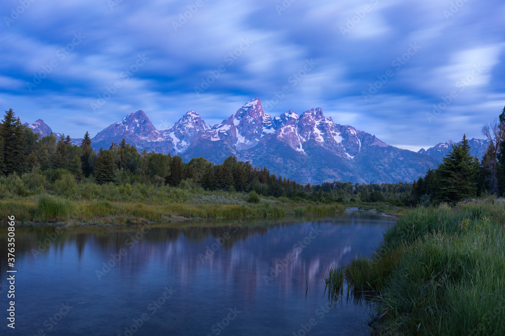 Scenic view of Schwabacher Landing and Snake River with mountains in background Scenic view of Schwabacher Landing and Snake River with mountains in background