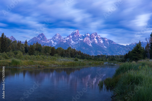 Scenic view of Schwabacher Landing and Snake River with mountains in background photo