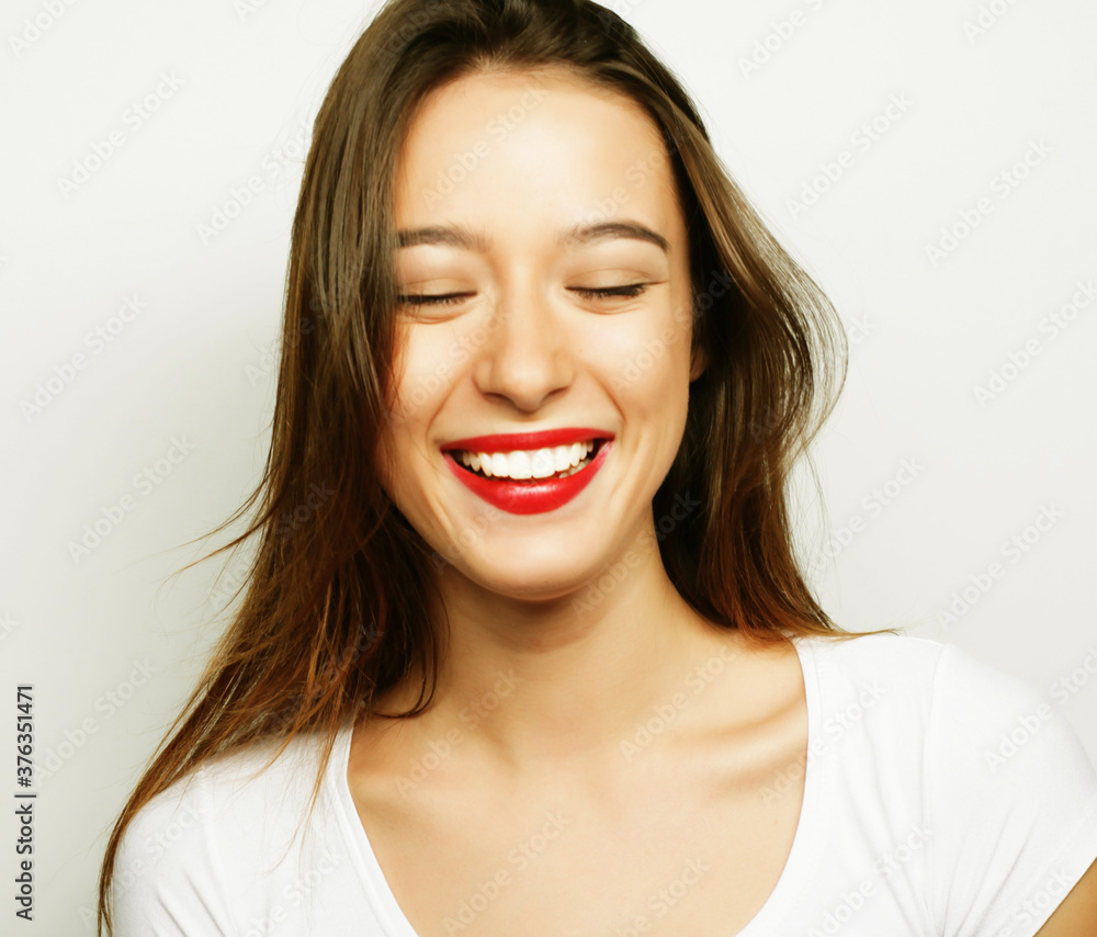 lifestyle, beauty and people concept: Young cute smiling female over white background