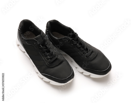 Pair of sportive male shoes on white background © Pixel-Shot