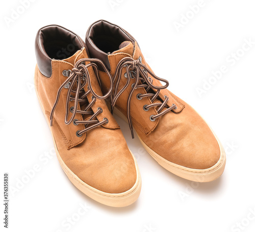 Pair of casual male shoes on white background