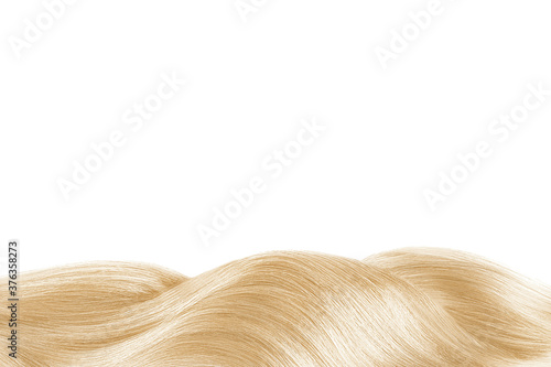 Blond shiny hair isolated on white. Background with copy space