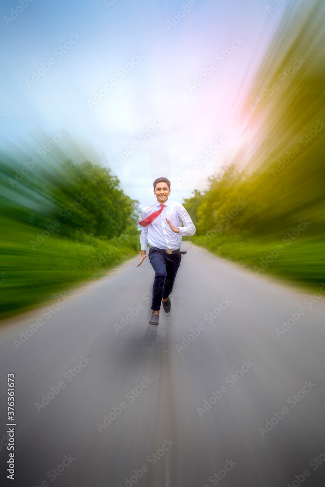 Young asian / Indian boy running on the road Young asian / Indian boy running on the road