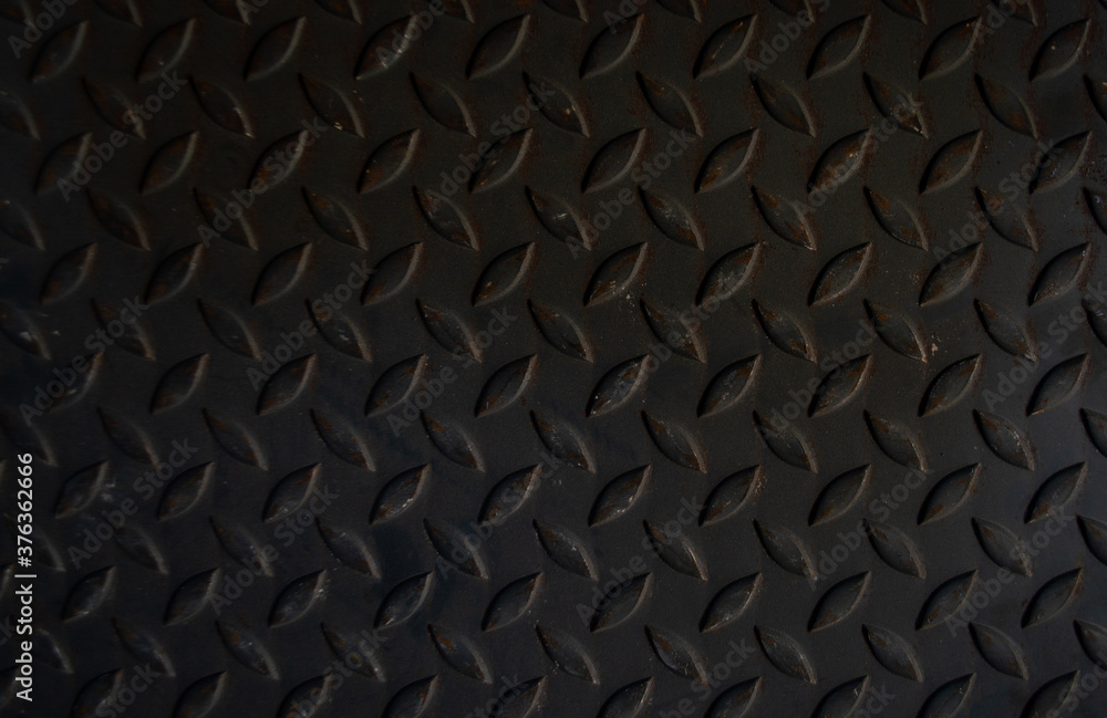 The old iron plate has a slightly rusted pattern. The old iron plate has a slightly rusted pattern.