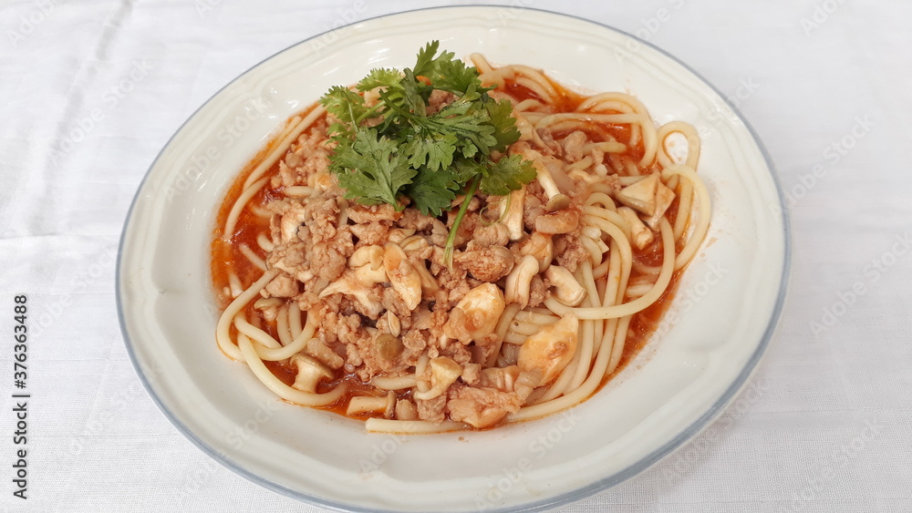 Spaghetti with mushrooms and Minced pork on a plate. Spaghetti with mushrooms and Minced pork on a plate.