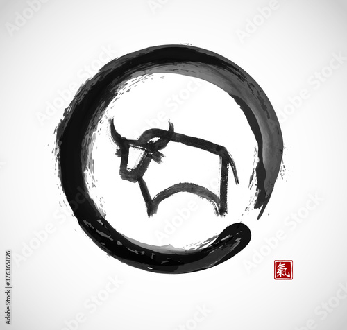 Ink painting of bull, chinese new year symbol of 2021 in black enso zen circle. Translation of hieroglyph - life energy