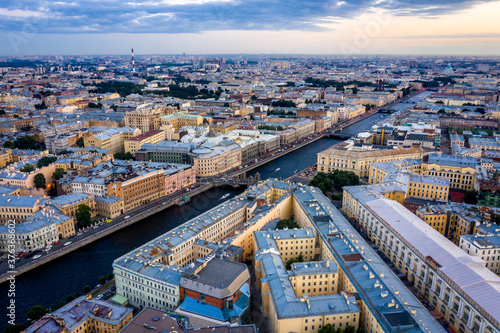 Aerial view of the city at sunset in Saint Petersburg, Panorama of the Fontanka River and the bridges across it. View of the city from above. Cities of Russia. Petersburg in the summer. photo