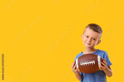 Little boy with rugby ball ...