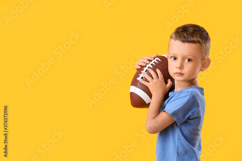 Little boy with rugby ball ...