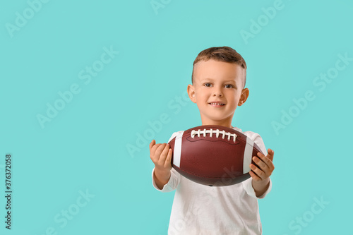 Little boy with rugby ball ...