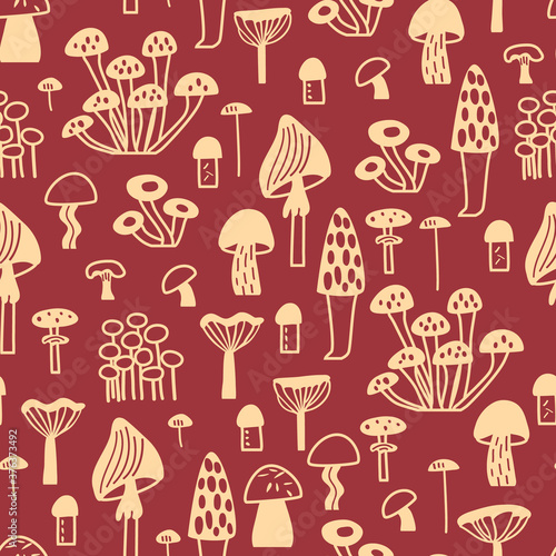 Simple seamless vector pattern with different mushrooms on red background. Childish cartoon endless illustration