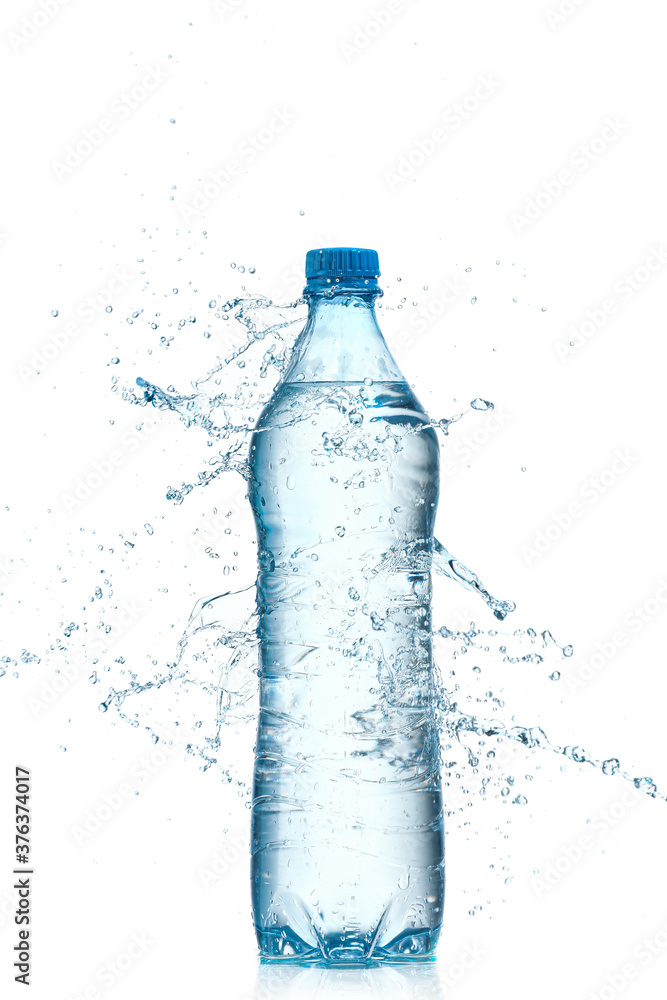 Bottle and splash of water on white background Bottle and splash of water on white background