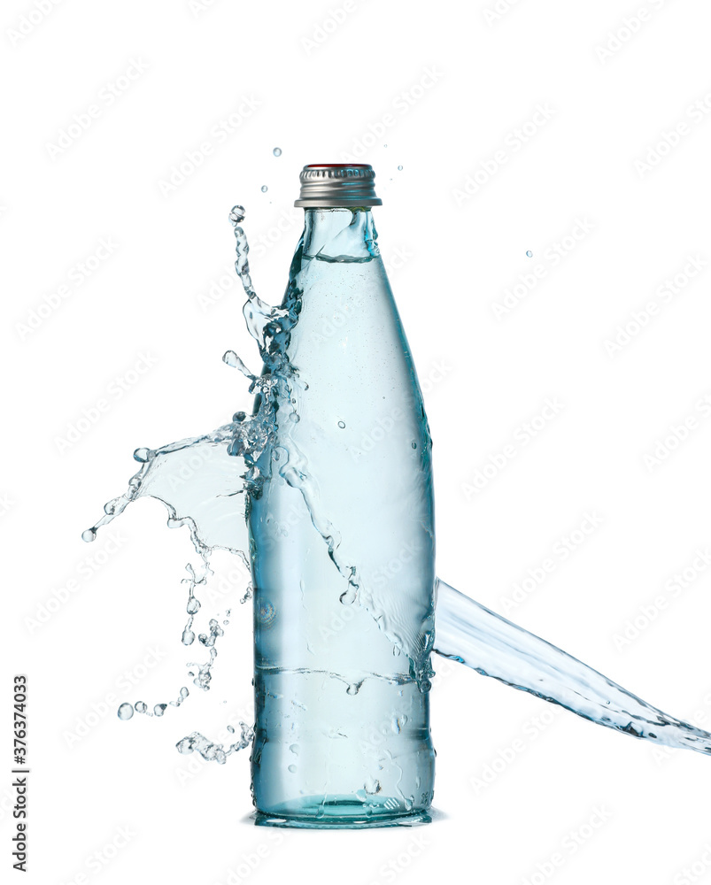 Bottle and splash of water on white background Bottle and splash of water on white background
