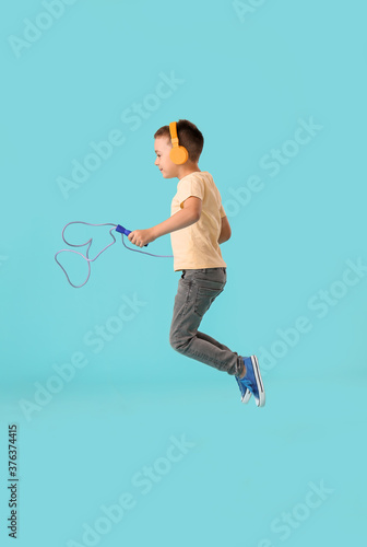 Cute little boy with headph...