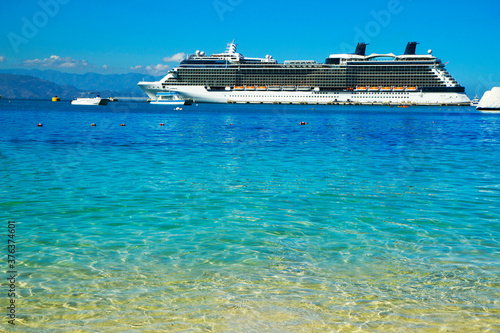 Haiti, Caribbean, Cruise ship off the coast. Ocean Liner is located off the island of Haiti (Caribbean). © galina_savina