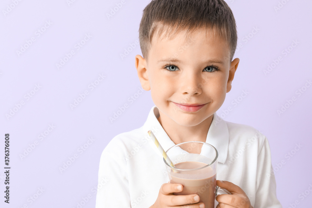 Little boy with tasty chocolate milk on color background Little boy with tasty chocolate milk on color background