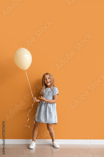 Little girl with balloon ne...