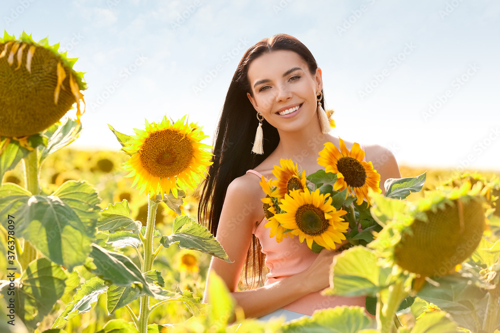 Beautiful young woman in sunflower field Beautiful young woman in sunflower field