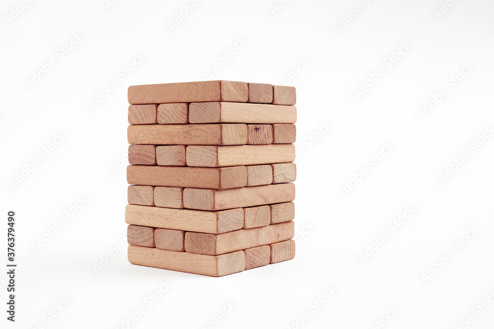 Wooden blocks stacked on white background. Accumulation, saving, safety or building in business concept. Wooden blocks stacked on white background. Accumulation, saving, safety or building in business concept.