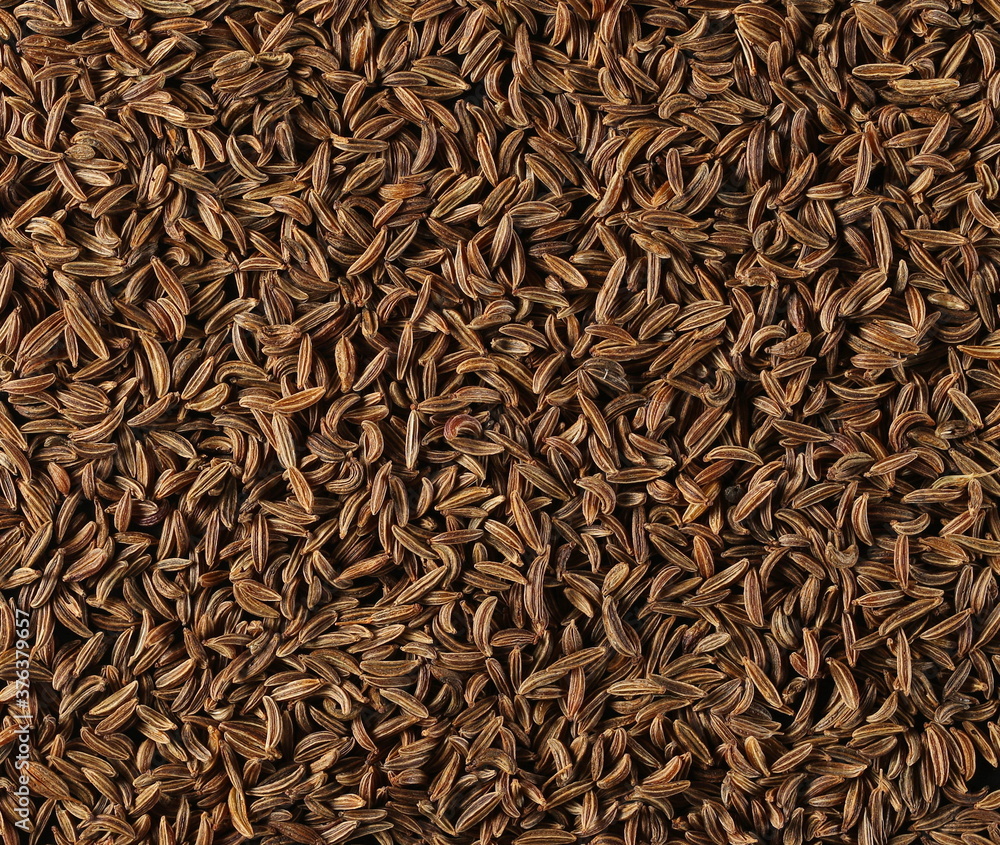 Cumin, caraway seeds background and texture