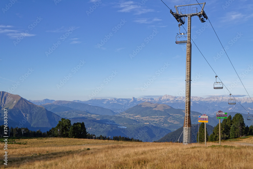 CHAMROUSSE, FRANCE, August 26, 2020 : Summer morning on the resort. Well-known ski resort near Grenoble, Chamrousse is a summer destination as well. CHAMROUSSE, FRANCE, August 26, 2020 : Summer morning on the resort. Well-known ski resort near Grenoble, Chamrousse is a summer destination as well.