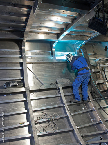 Welding. Aluminium hull of a yacht at the shipyard. Airframe. Ship building industry. Super sailing yacht. Netherlands. 