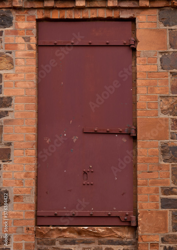 Old Single Steel Door with Stone Walls © Evo