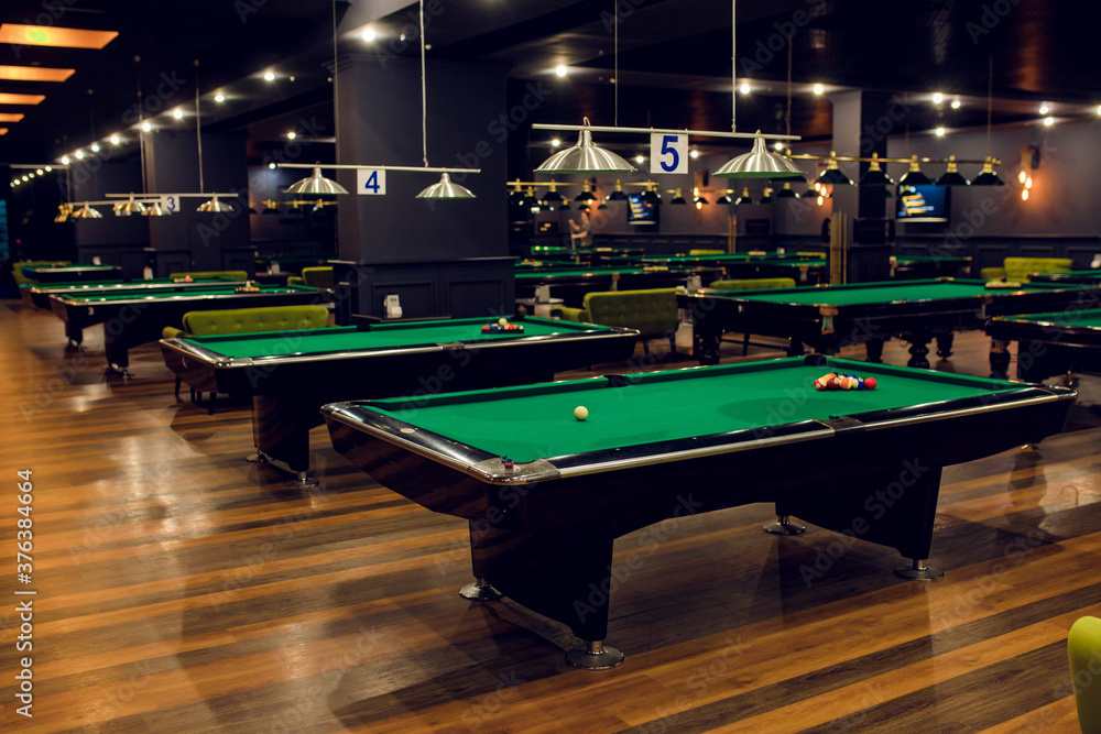 Billiard tables in a fashionable night club Photos | Adobe Stock
