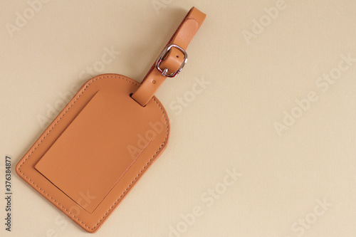 Brown leather luggage labels.