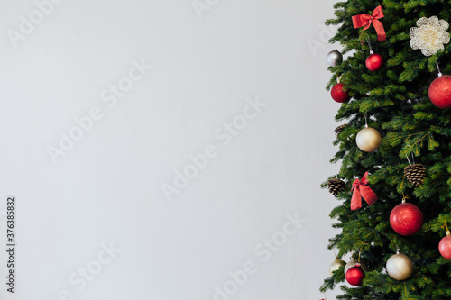 Green Christmas tree with red gifts for new year holiday decor