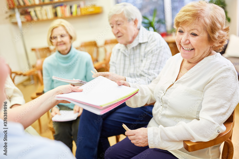 Group of seniors in a nursing home undergoing painting therapy Group of seniors in a nursing home undergoing painting therapy