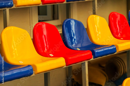 Wallpaper Mural Multicolored Empty plastic chairs in the stands of the stadium. Many empty seats for spectators in the stands. Empty plastic chairs for football fans in the gym. Bright colorful seats for stadium fans Torontodigital.ca