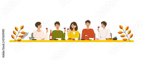 秋の食事とワインを楽しむ人々のイラスト