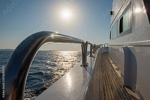 View from a yacht travelling at sunrise photo