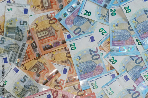 euro many banknote bills in financial background of different european cash money for wallpaper in top view