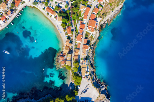 Aerial top down view to the little village of Asos, situated on a small land strip over turquoise sea, Kefalonia island, Greece