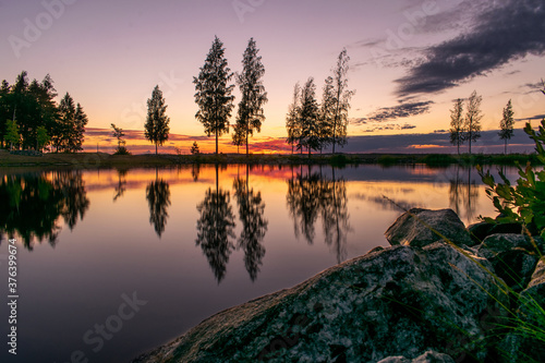 Fototapeta Naklejka Na Ścianę i Meble -  Sunset over the lake Näsijärvi with reflection in Tampere, Finland
