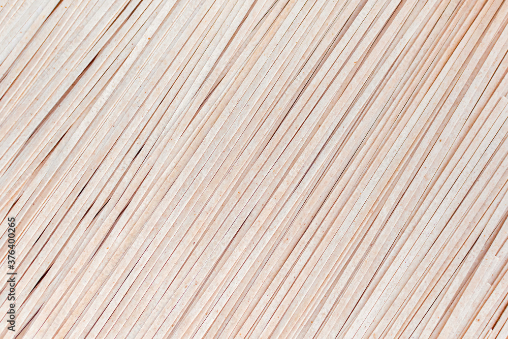 Background of brown soba noodles close up. Asian cuisine, buckwheat pasta, raw, uncooked, dried, natural, organic, vegetarian healthy food. Striped surface. Background of brown soba noodles close up. Asian cuisine, buckwheat pasta, raw, uncooked, dried, natural, organic, vegetarian healthy food. Striped surface.